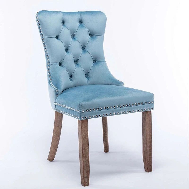 Chaise de salle à manger capitonnée en velours avec pieds en bois cloutés