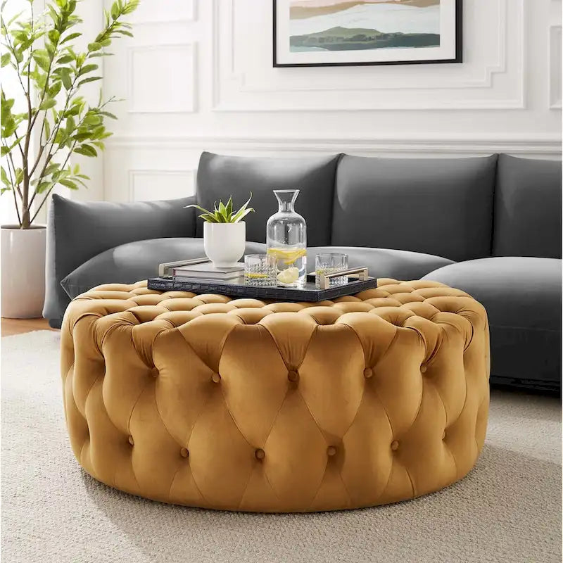 Grand pouf rond capitonné en velours performance