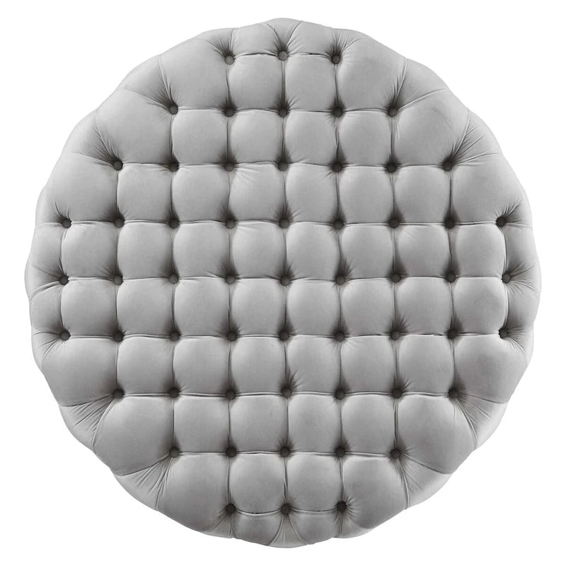 Grand pouf rond capitonné en velours performance